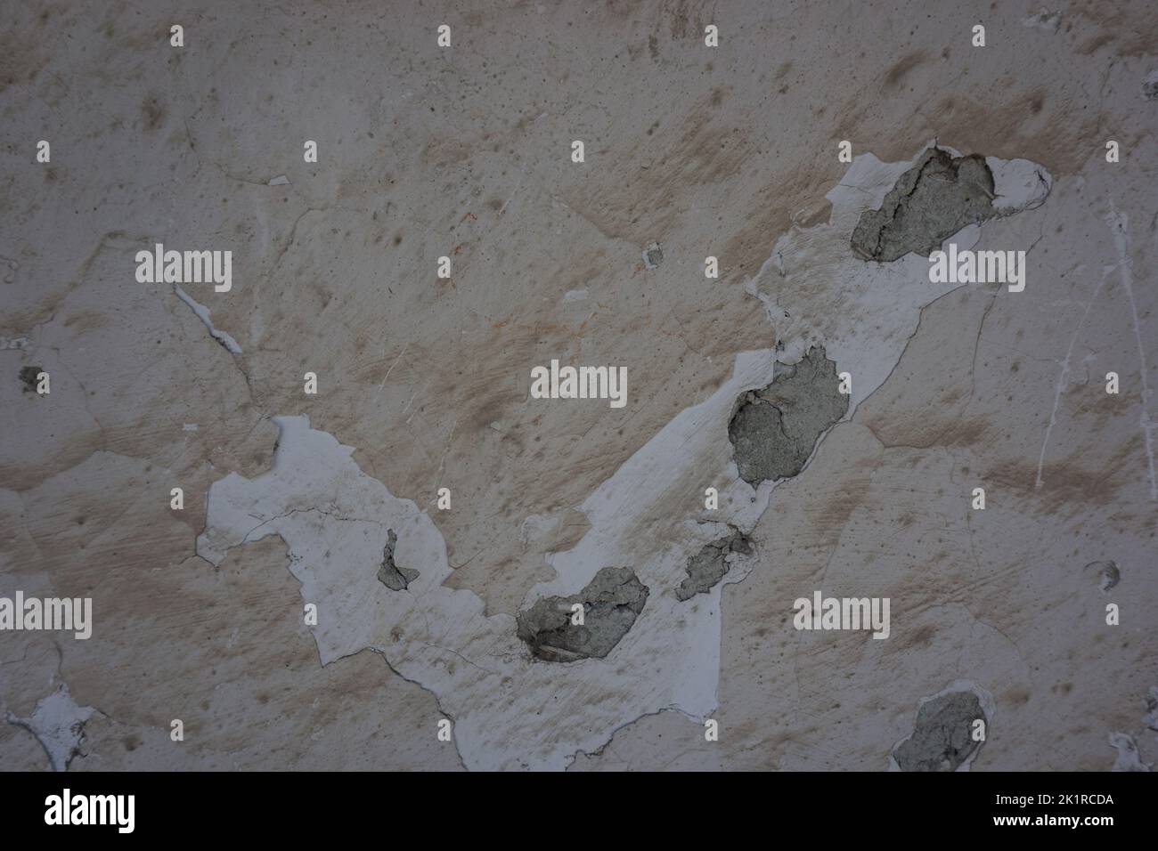 close-up of peeled cream-colored wall, dirty and worn, background, copy space Stock Photo