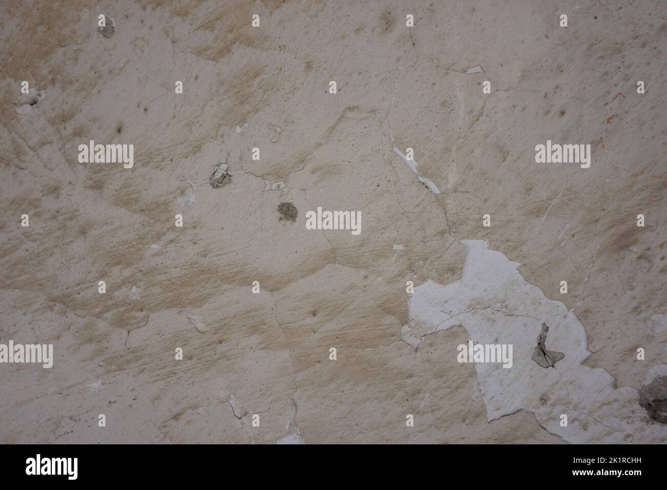 close-up of peeled cream-colored wall, dirty and worn, background, copy space Stock Photo