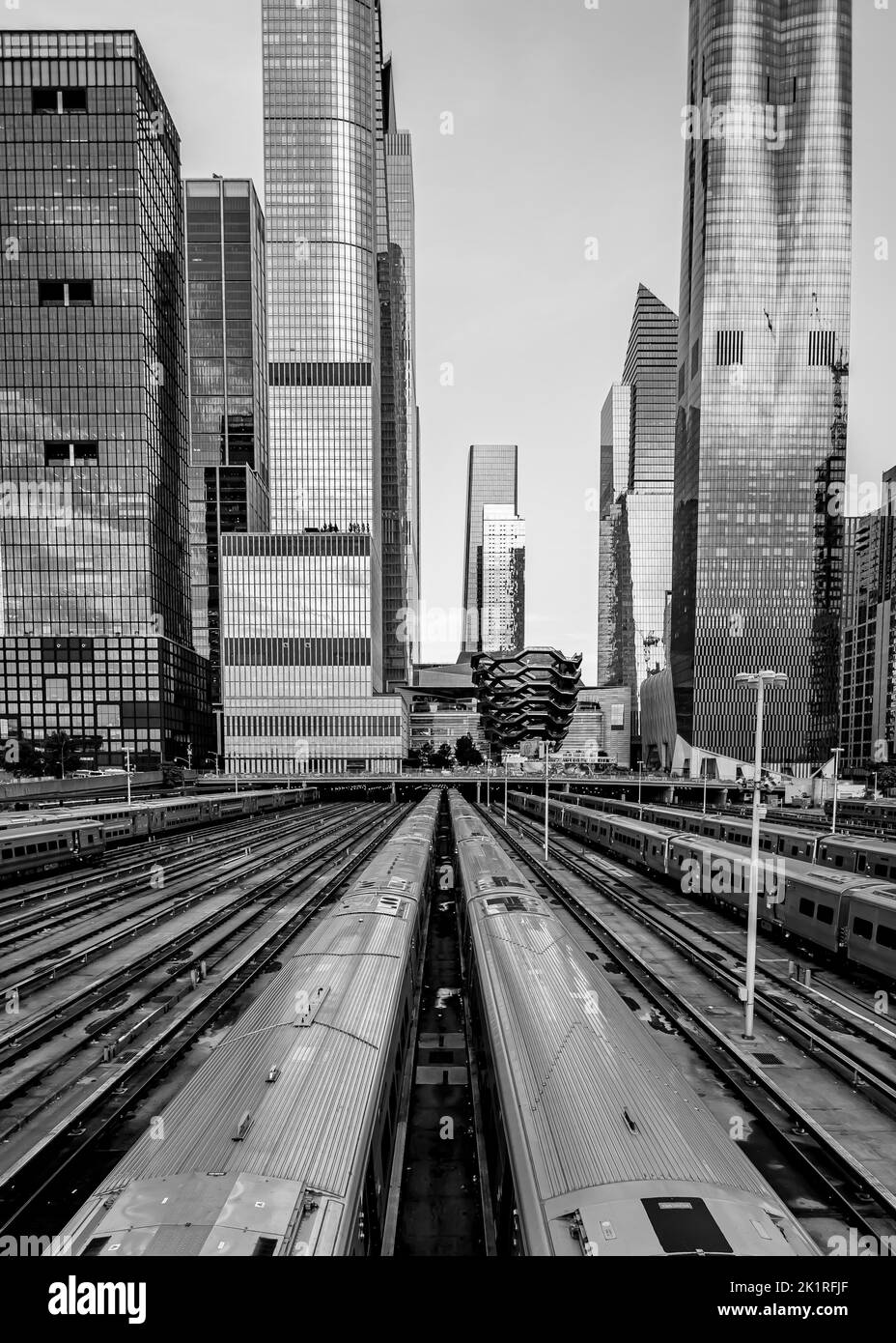 A vertical grayscale shot of midtown New York with subway transports ...