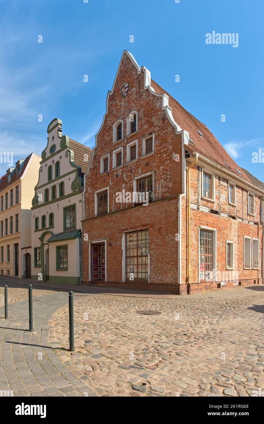 Historic 17th century Baroque gabled houses opposite the Brauhaus am Lohberg at the Old Harbour in the Old Town of Wismar, Germany. Stock Photo