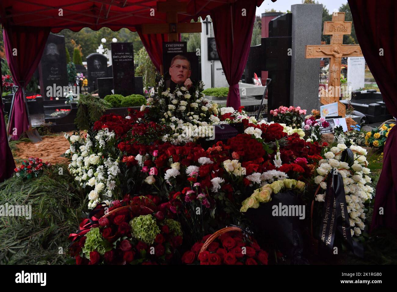 Moscow. A portrait and flowers on a tomb of the CEO of media group of Komsomolskaya Pravda Vladimir Sungorkin on the Troyekurovskoye Cemetery. Stock Photo