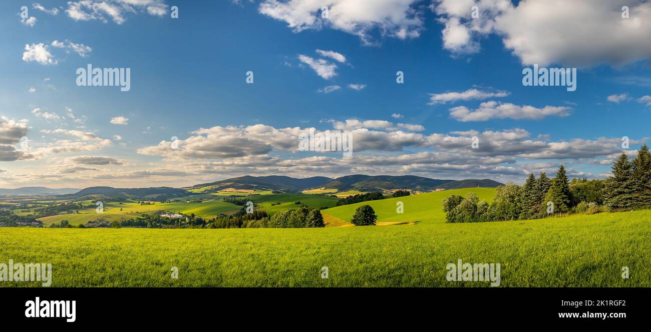 countryside landscape with hill, field and forest, Orlicke mountains, Czech republic Stock Photo