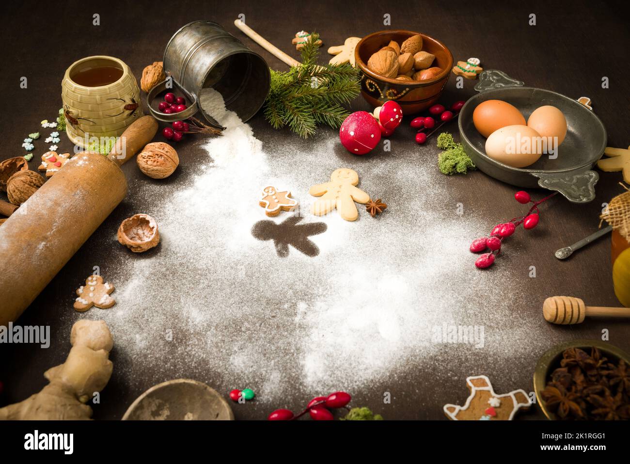 Vintage still life of Christmas gingerbread cookies and their ingredients arranged in a colourful circle Stock Photo