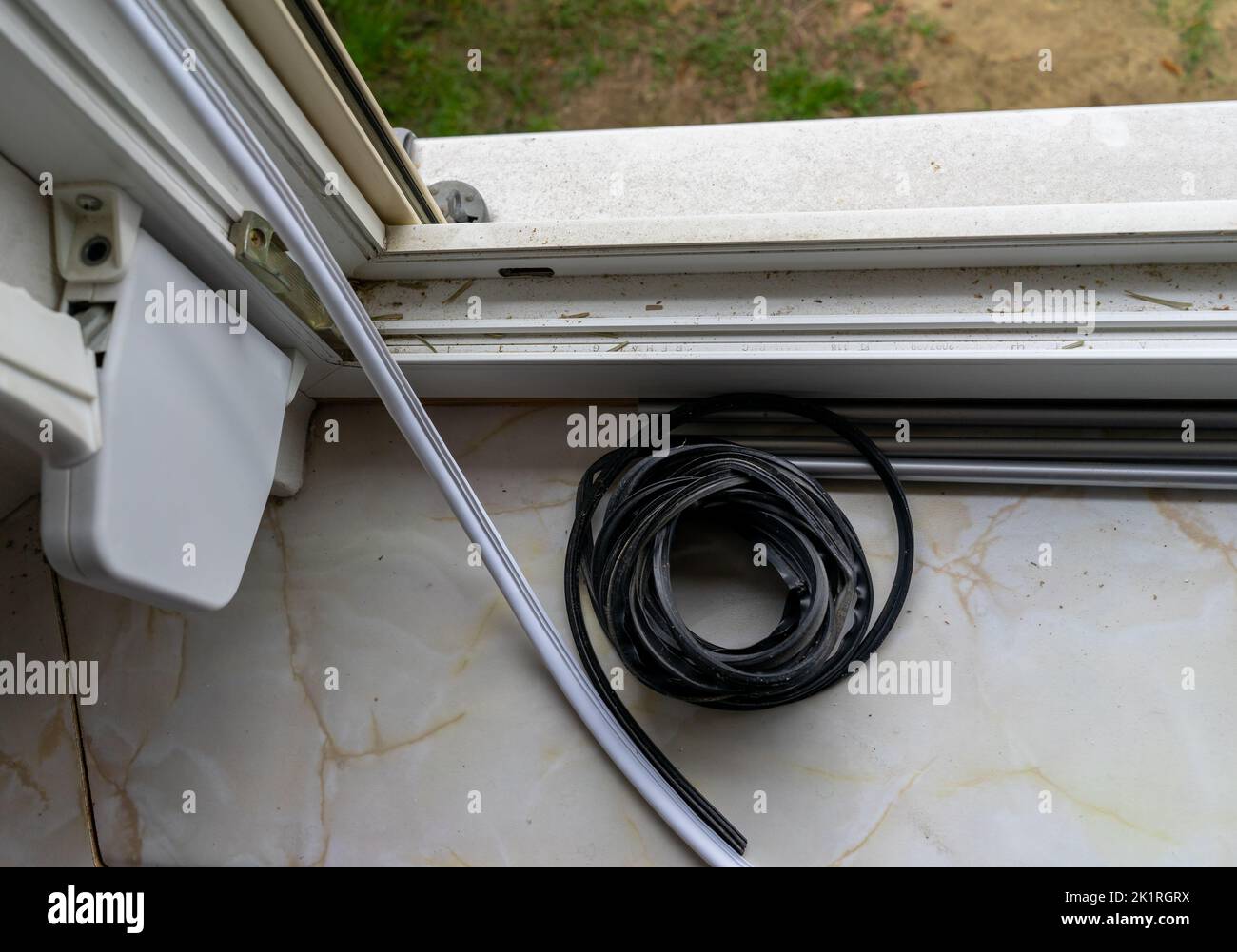 Replace rubber seal on window Stock Photo