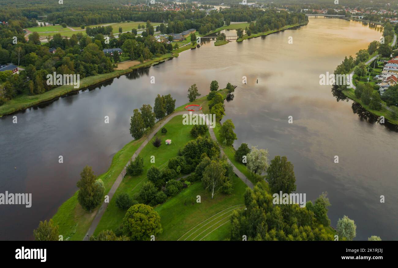 An aerial view of green lake surrounded by growing lush trees Stock ...