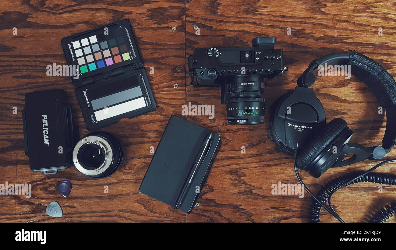A top view of the camera and photography tools on a table Stock Photo