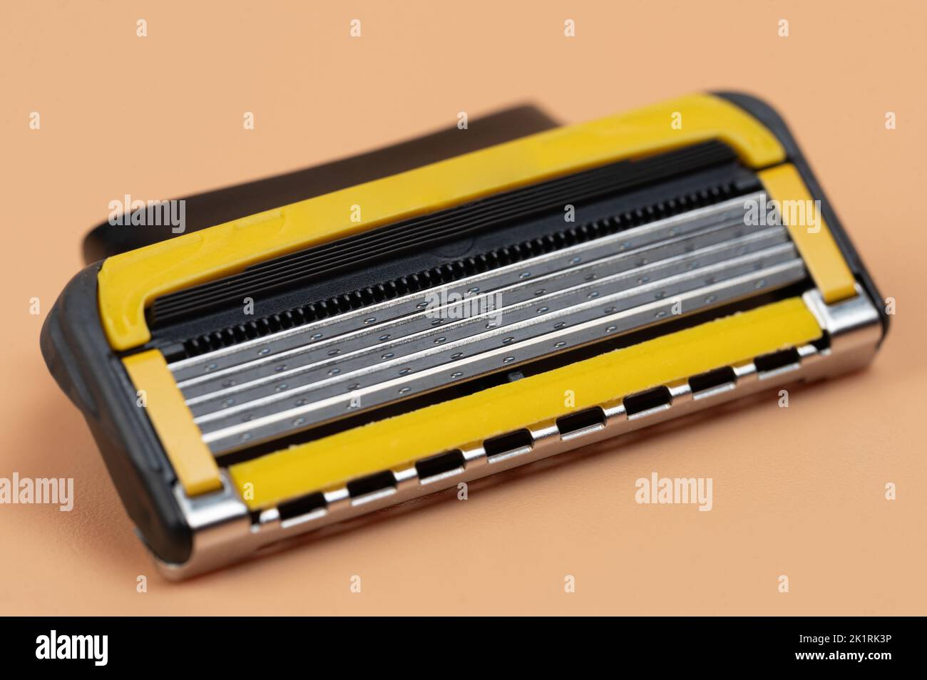Sharp razor blade cassette  macro close up view on brown background Stock Photo
