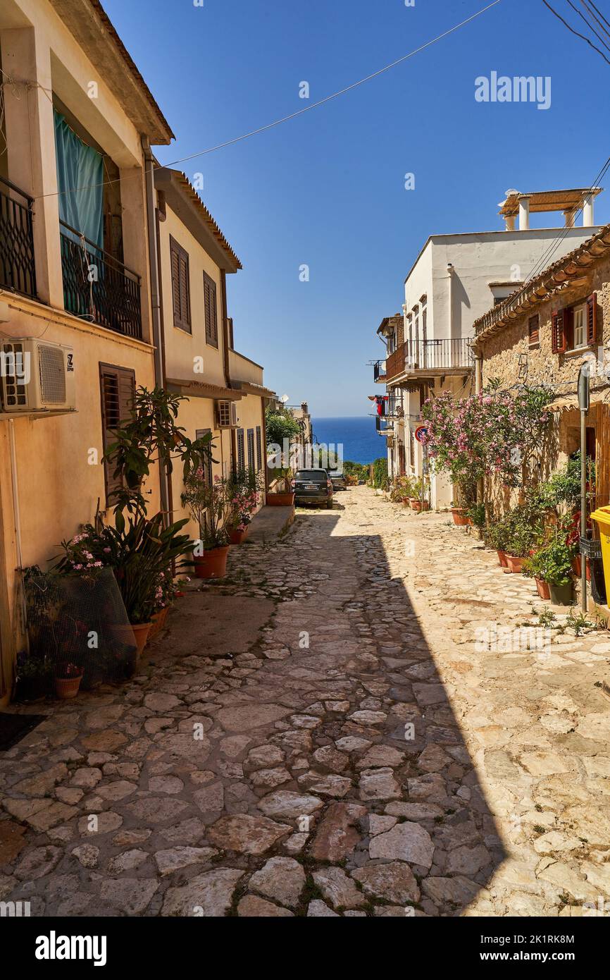 A street between houses facing the sea on a sunny morning Stock Photo