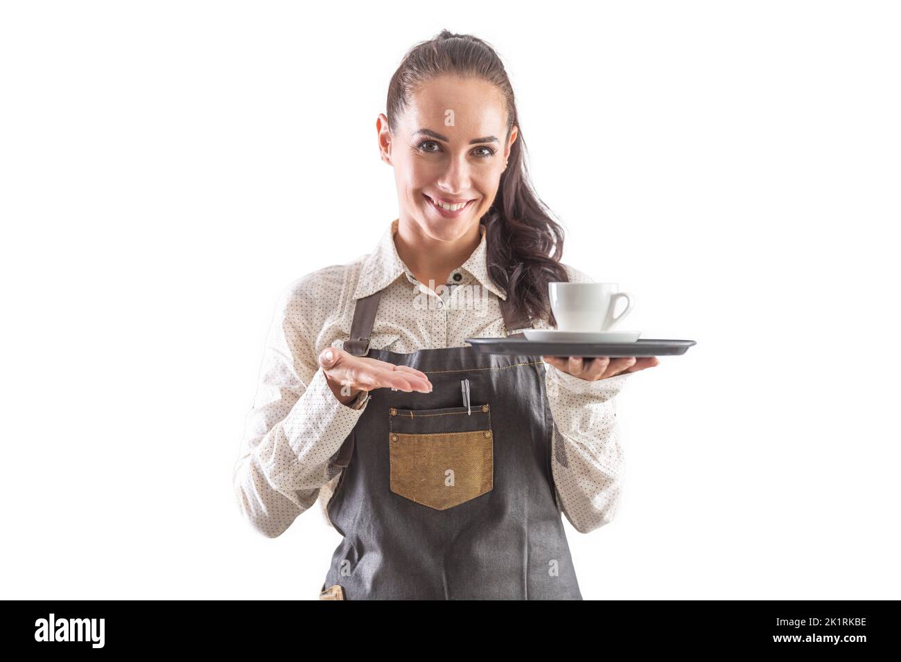 Beautiful waitress in apron offering coffee on white isolated background. Stock Photo