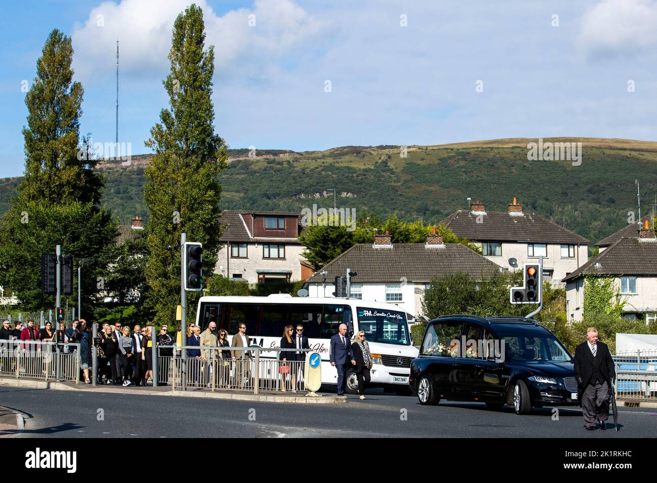 Mourners walk behind the coffin of Hollie Thomson as it makes it way to St Michael's Church in west Belfast. Picture date: Tuesday September 20, 2022. Stock Photo