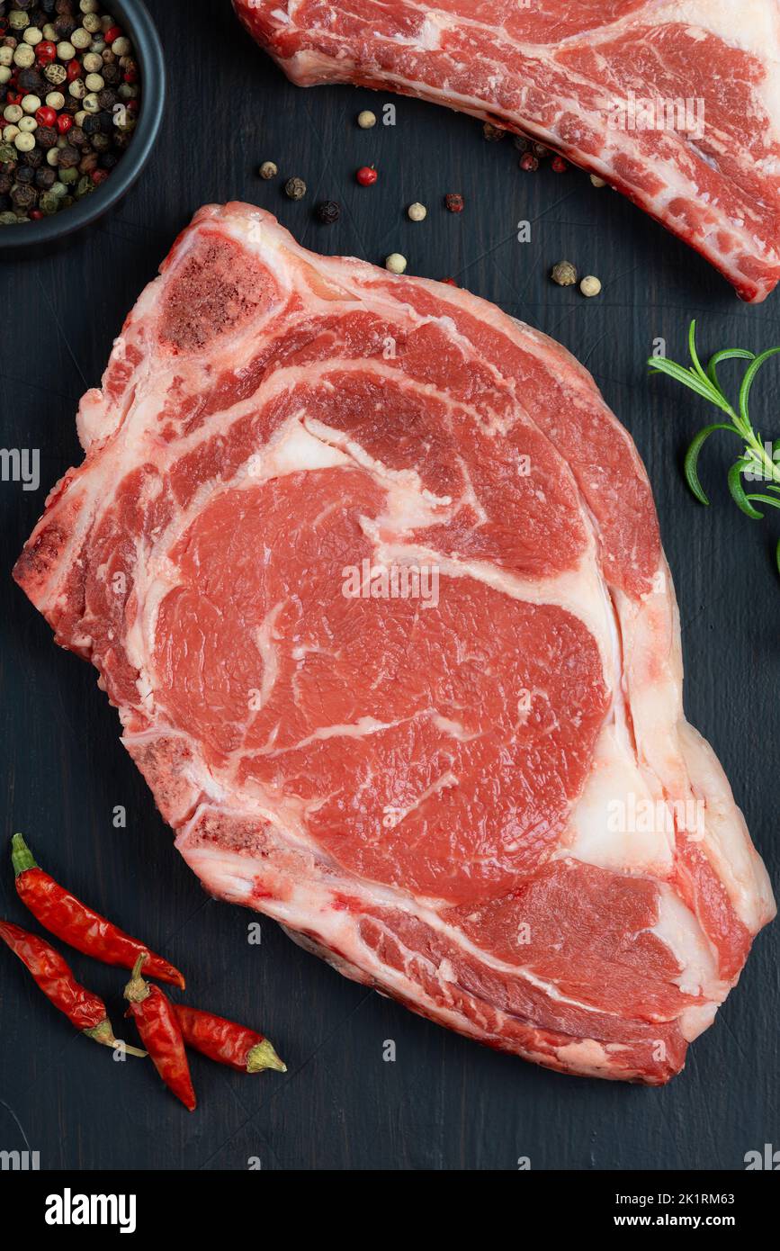 Raw meat beef steak. Black angus prime meat set - ribeye, striploin Stock Photo