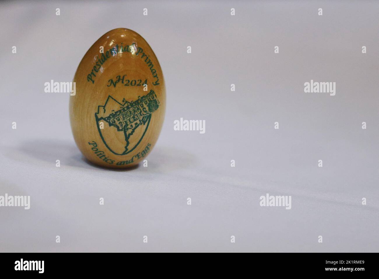 The 2024 version of the New Hampshire presidential primary souvenir egg stands on table before former U.S. Secretary of State Mike Pompeo speaks at a 'Politics and Eggs' forum at Saint Anselm College in Manchester, New Hampshire, U.S., September 20, 2022.     REUTERS/Brian Snyder Stock Photo