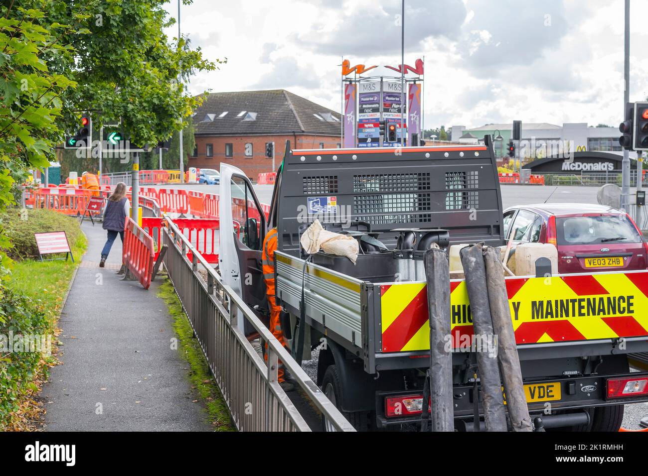 Roadworks at a busy junction to a UK retail site Stock Photo Alamy