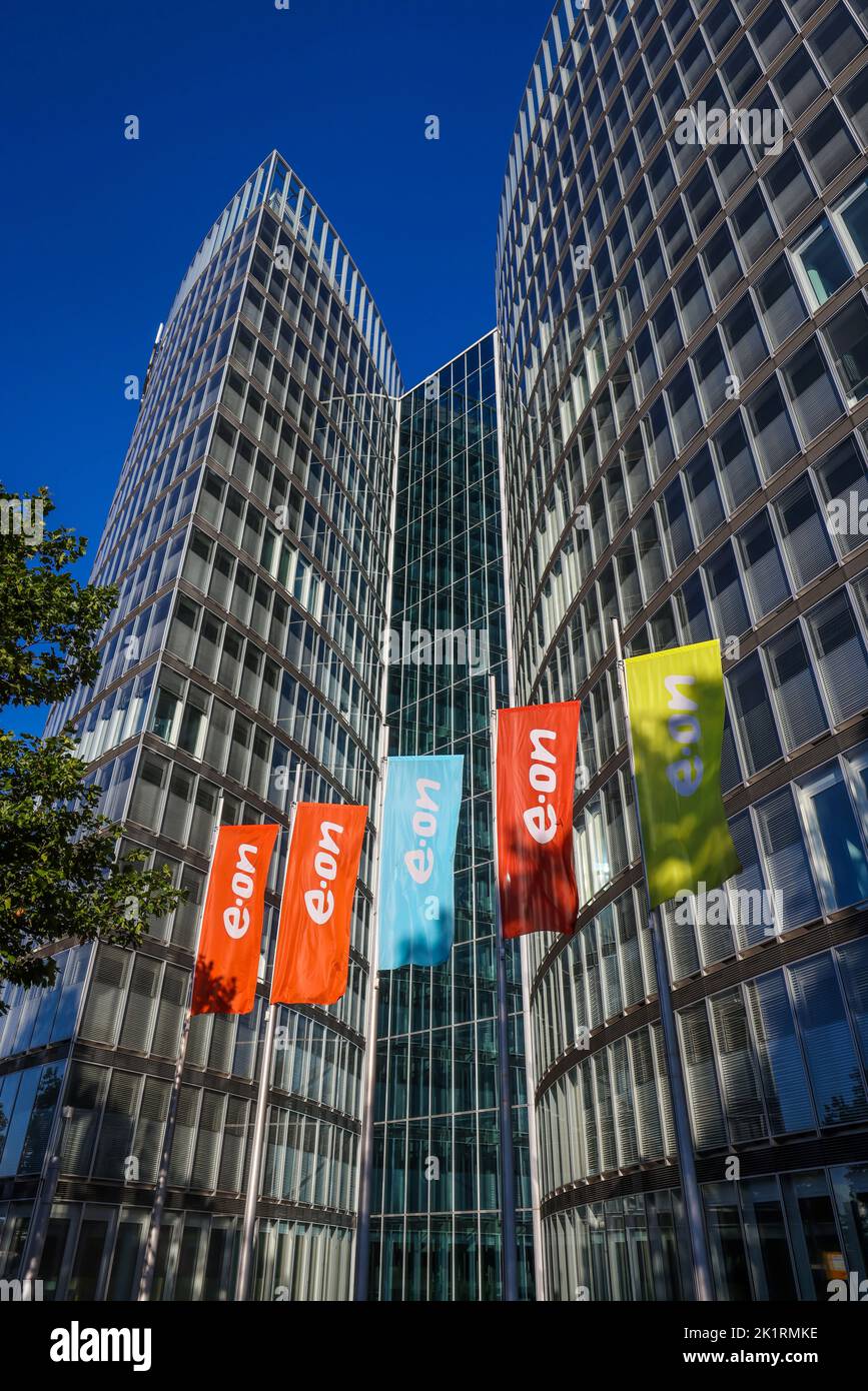 Essen, North Rhine-Westphalia, Germany - E.ON headquarters. e.on company logos on flags in front of the headquarters. Stock Photo