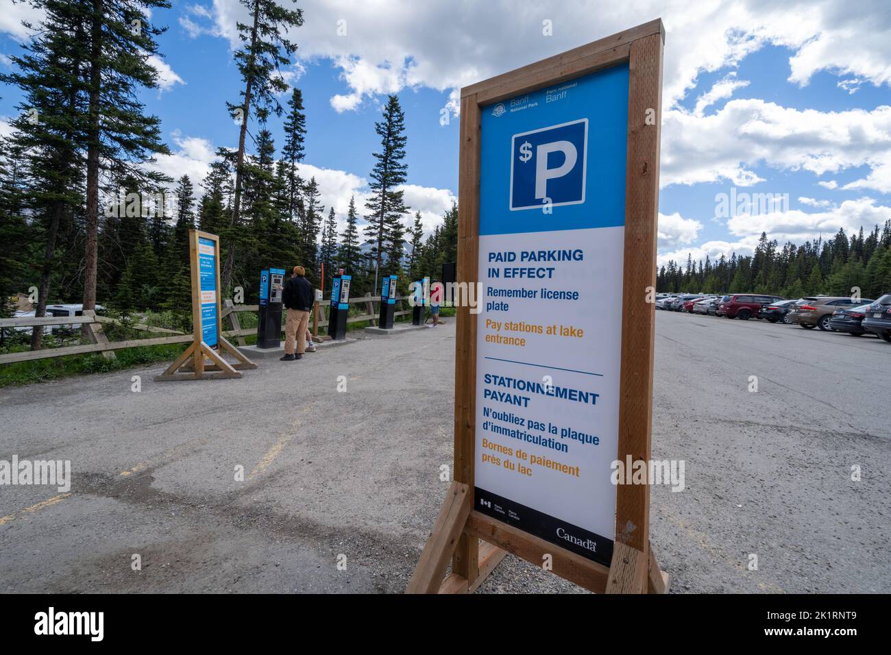 Lake Louise, Alberta, Canada - July 9, 2022: Sign reminding tourists that paid parking is in effect, at the Lake Louise parking lot Stock Photo