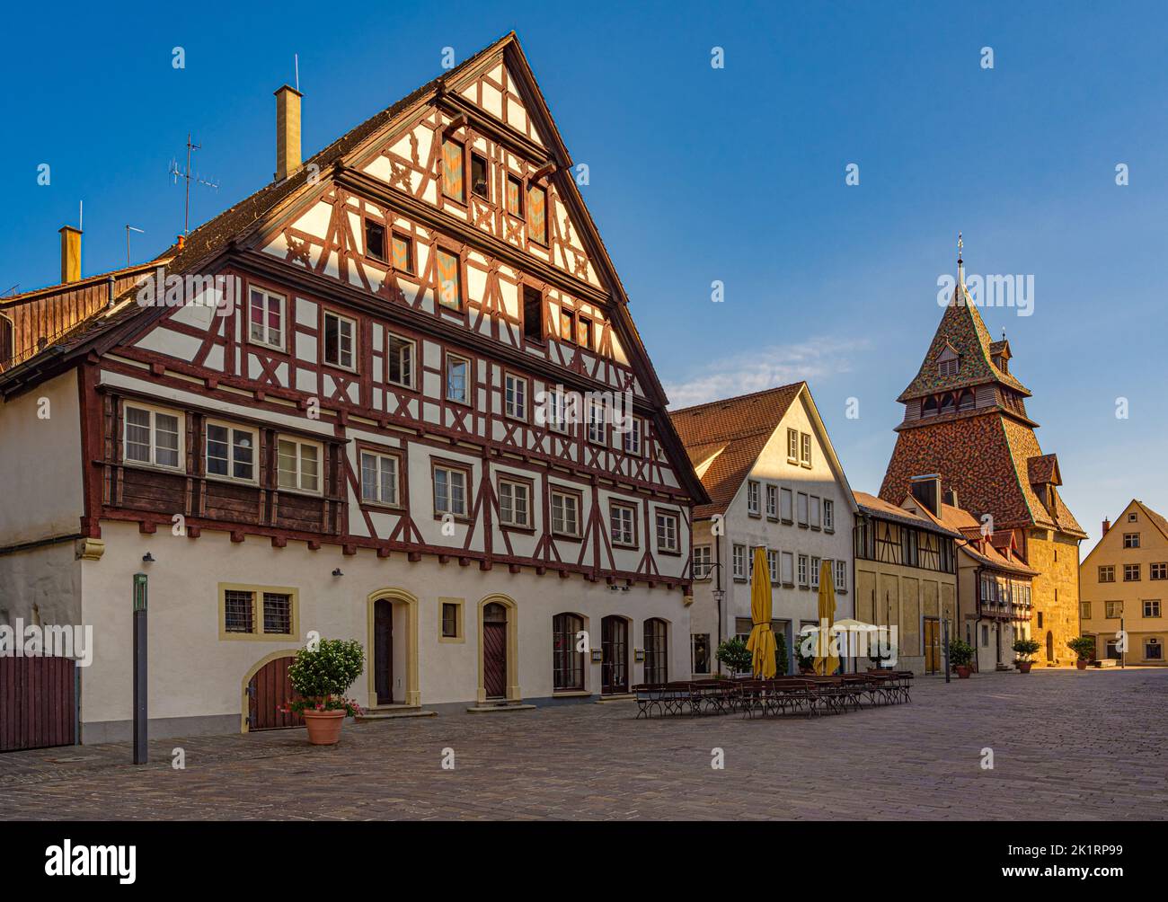 Half-timbered house and bell tower behind the Holy Cross Minster, Schwäbisch Gmünd, Baden-Württemberg, Germany, Europe Stock Photo