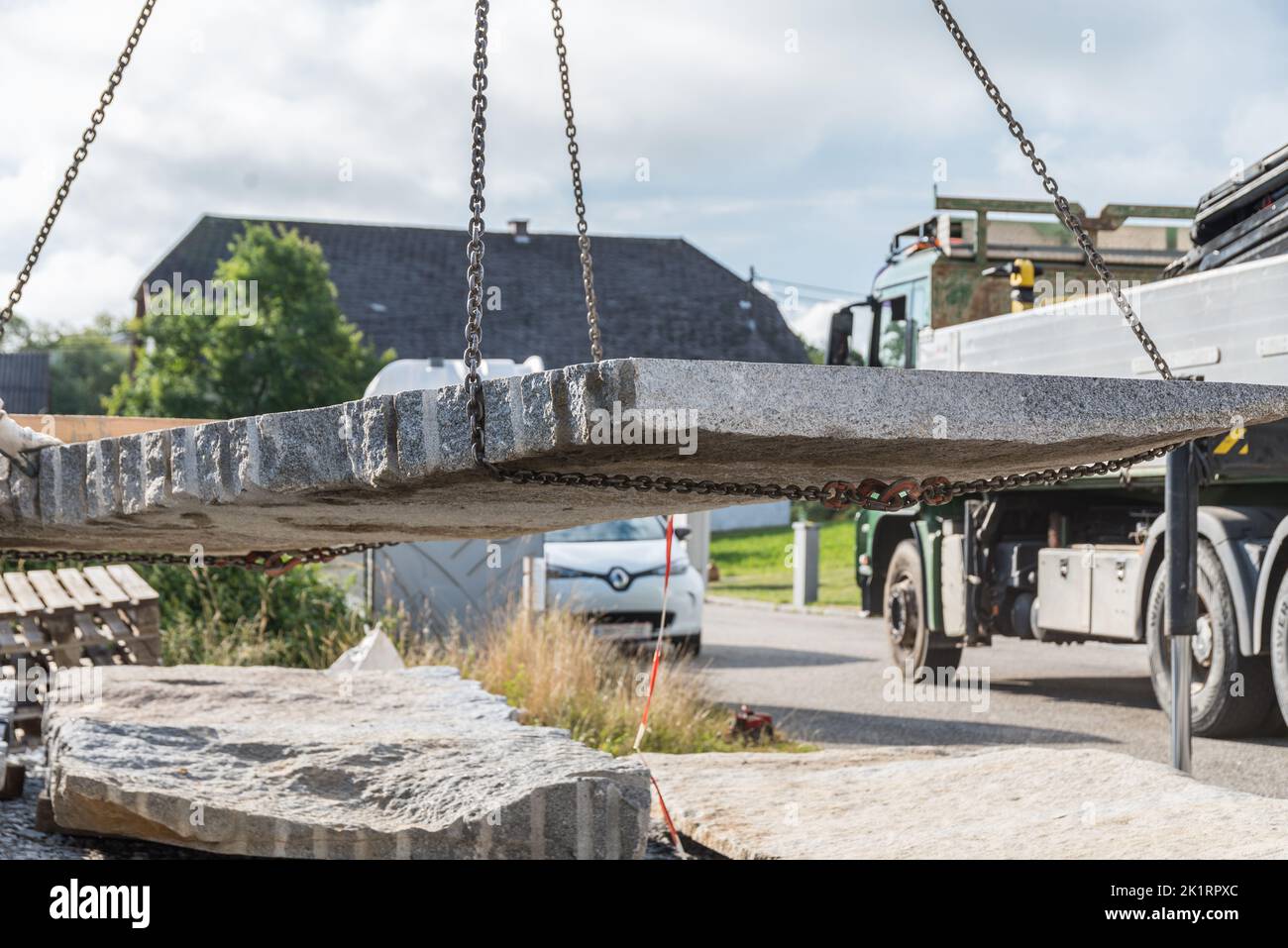 Unloading Granite Slabs With Construction Crane On Building Site - Natural Stone Granite Stock Photo