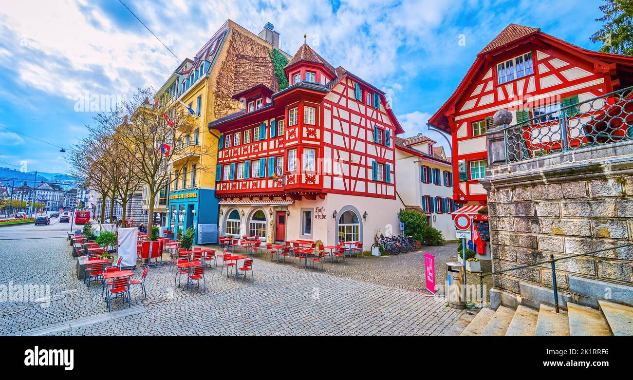 LUCERNE, SWITZERLAND - MARCH 30, 2022: Panorama of pedestrian Leodegarstrasse with historical half timbered houses and outdoor restaurant, on March 30 Stock Photo