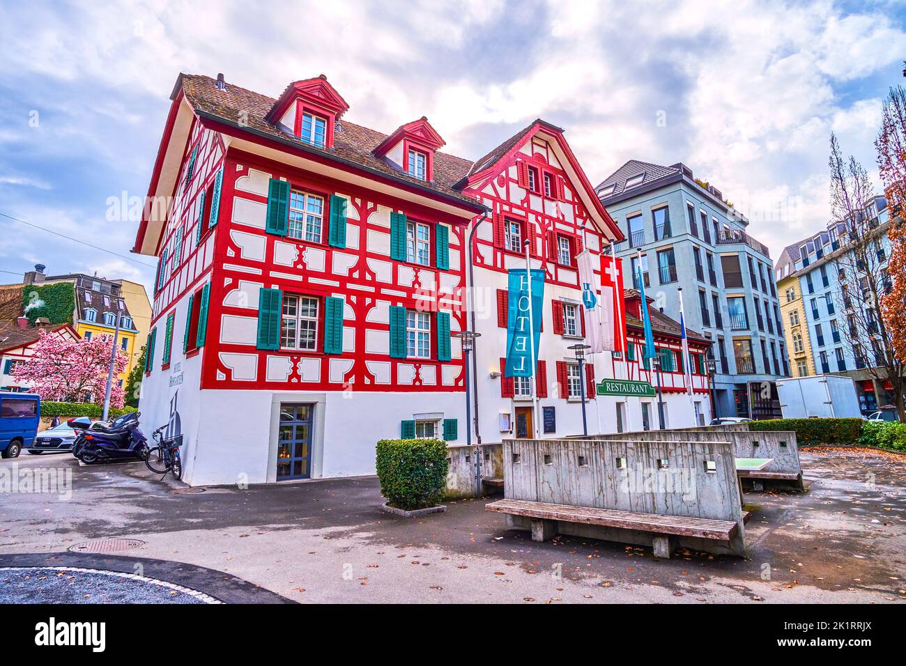 LUCERNE, SWITZERLAND - MARCH 30, 2022: St The scenic historic half-timbered house, serves as hotel and restaurant, on March 30 in Lucerne, Switzerland Stock Photo
