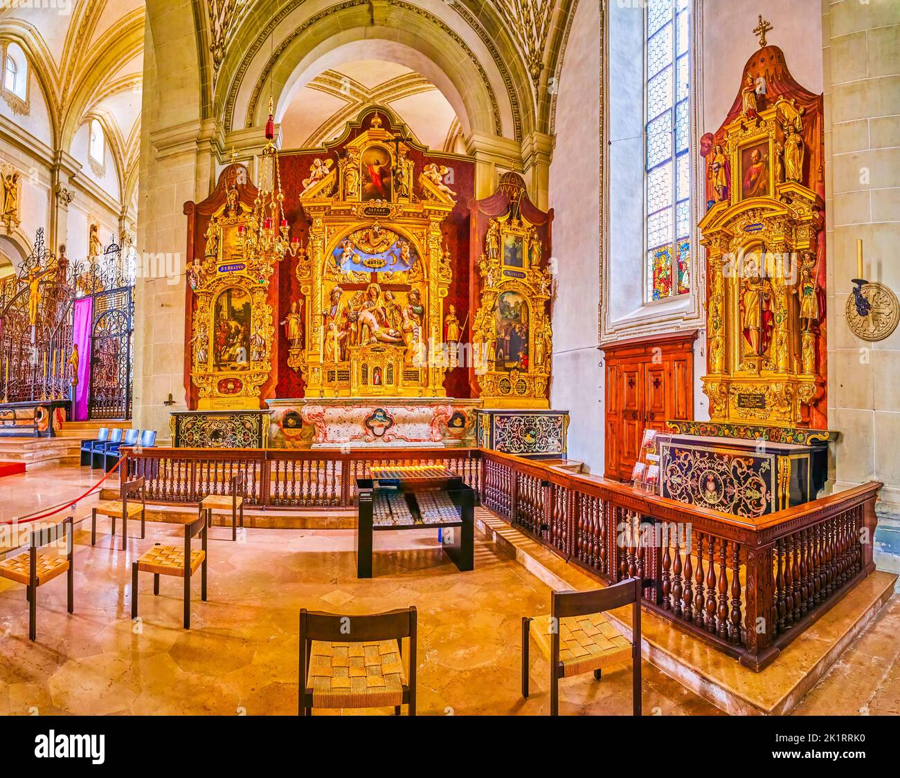 LUCERNE, SWITZERLAND - MARCH 30, 2022: St Panorama of interior of St Leodegar Church with side chapels with golden altarpieces, on March 30 in Lucerne Stock Photo