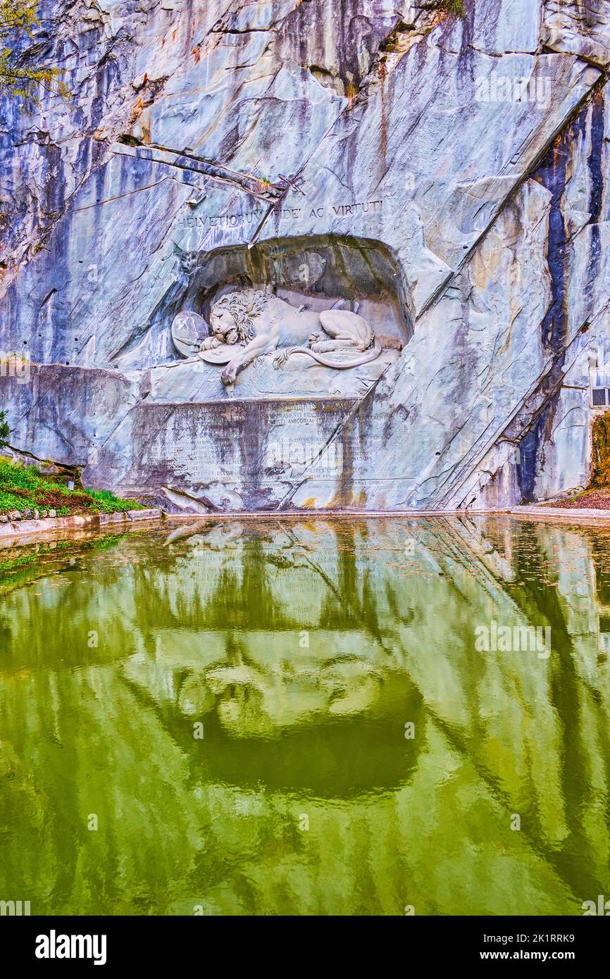 Carved stone monument to dying lion, the Lion of Lucerne (Lowendenkmal) is the most famous in Switzerland Stock Photo