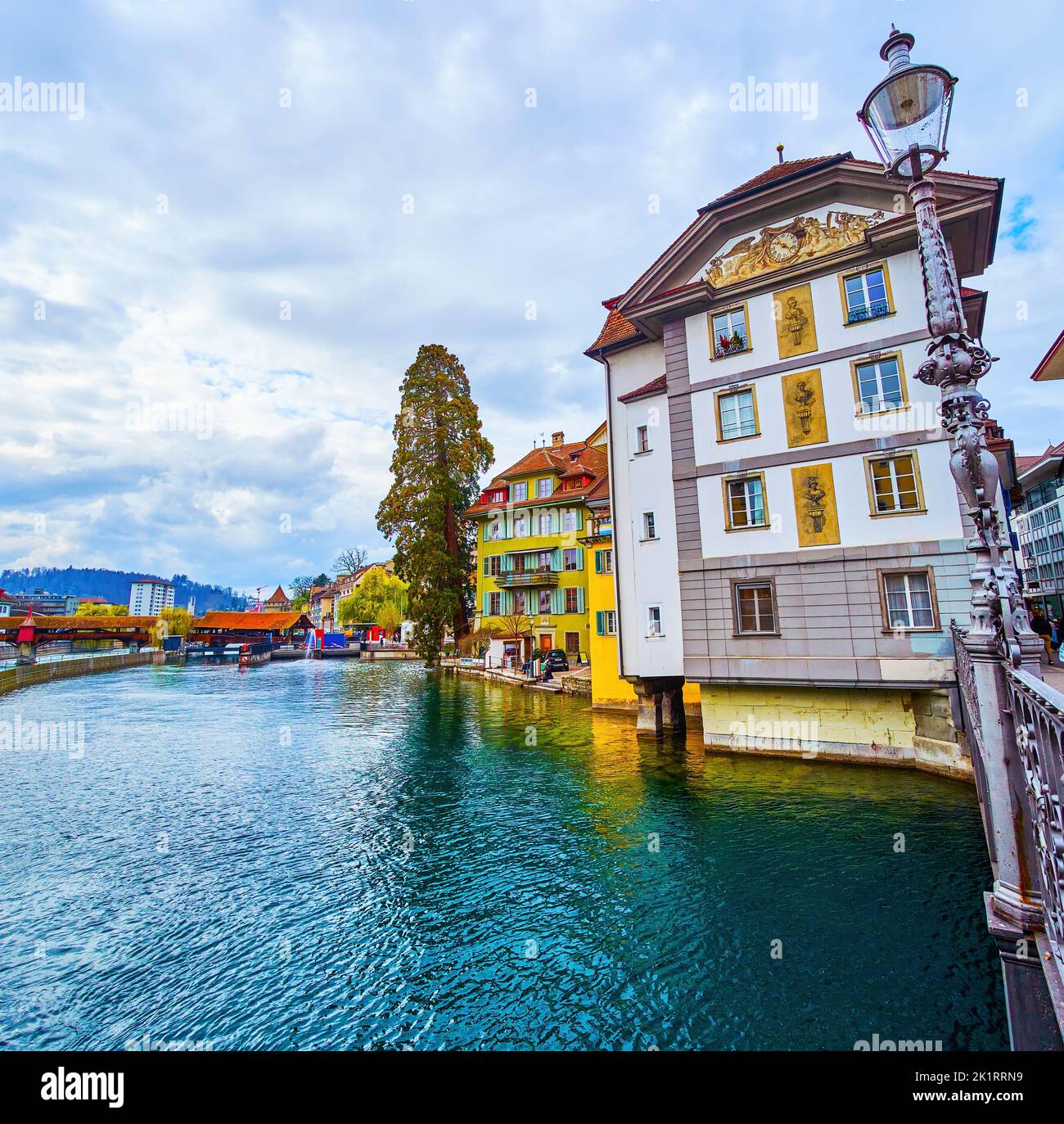 Magnificent medieval houses with wall paintings along Reuss river in old town in Lucerne, Switzerland Stock Photo
