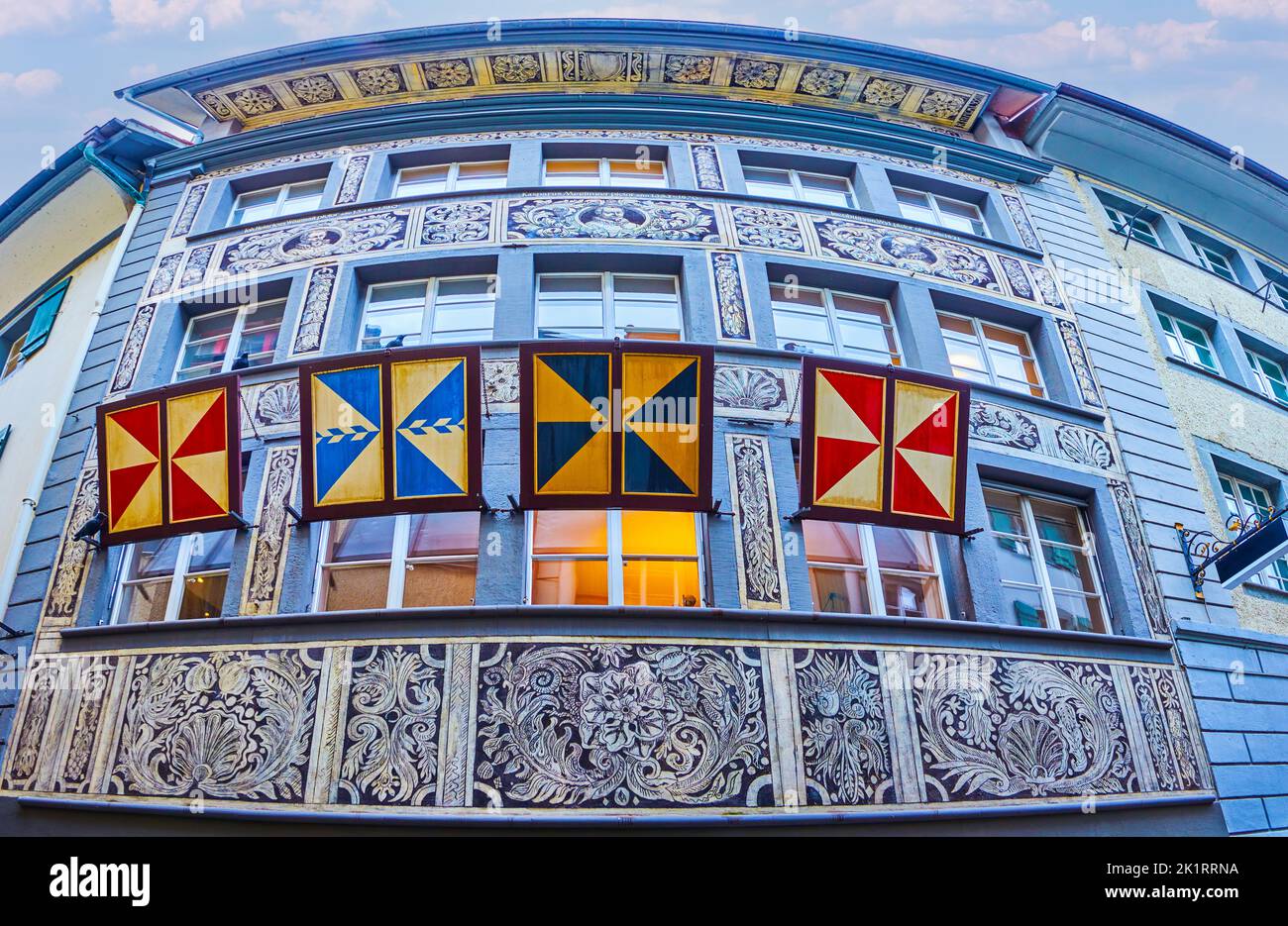 Outstanding historical frescoes  and guild flags on facades of townhouses in Lucerne, Switzerland Stock Photo