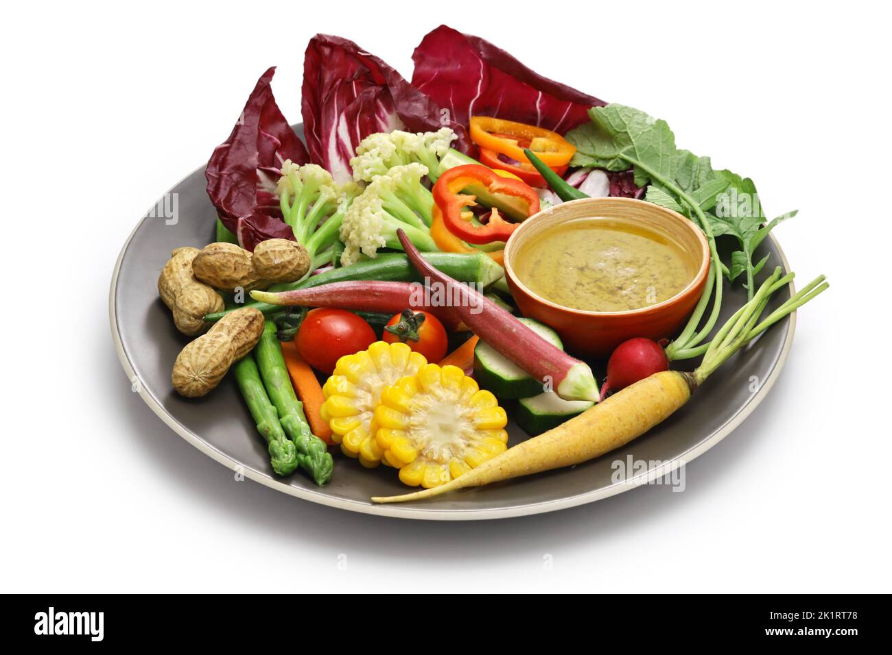 vegetable salad and bagna cauda (a garlic and anchovy sauce for dipping vegetables) Stock Photo