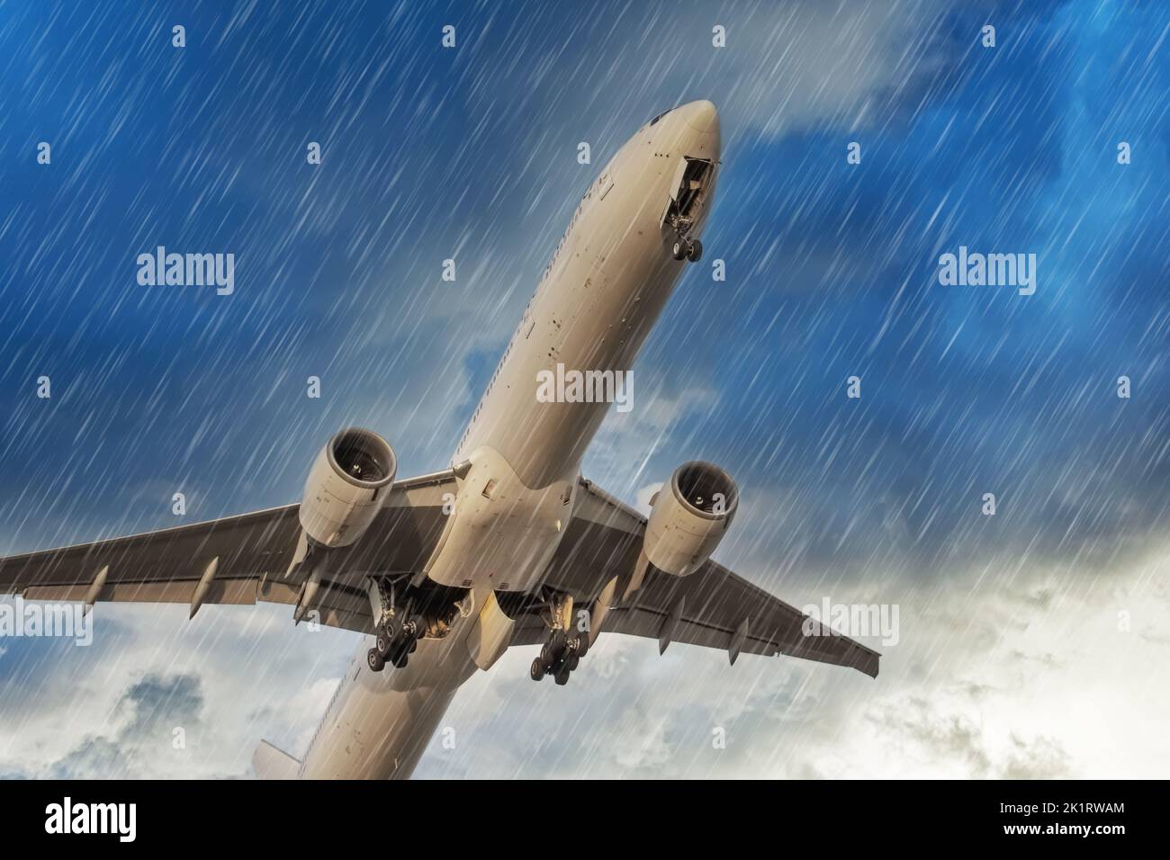 Airplane takes off rapidly during in bad weather storm hurricane rain llightning strike Stock Photo