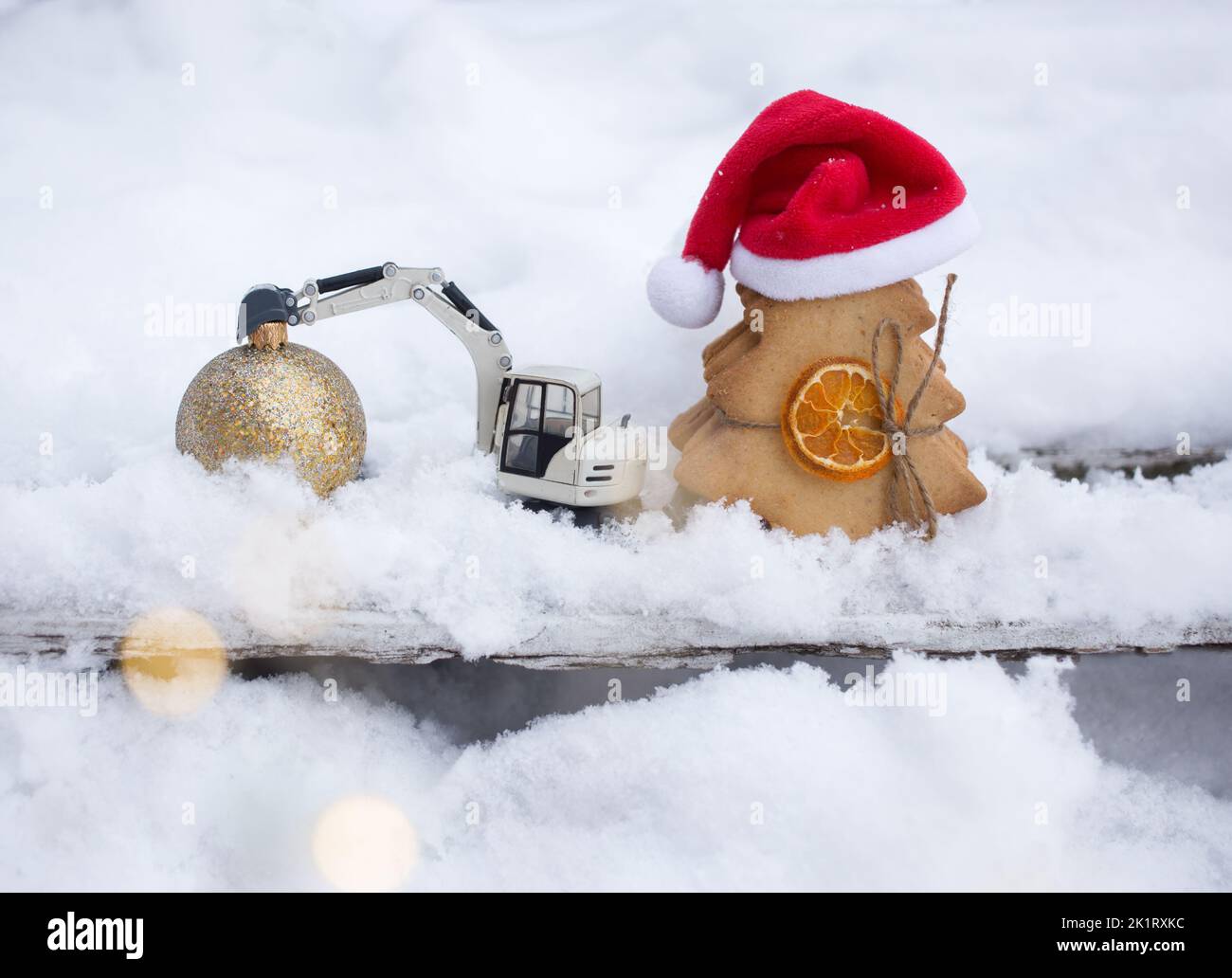 model of toy metal excavator and a gingerbread in form of Christmas ...