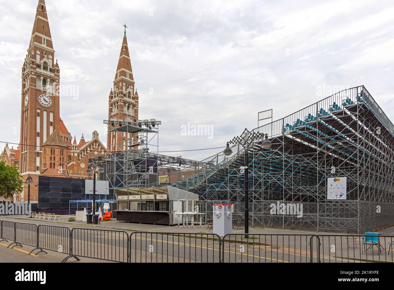 Szeged, Hungary - July 30, 2022: Temporary Stage and Stands Concert Venue in Front of Votive Church Cathedral During Summer. Stock Photo