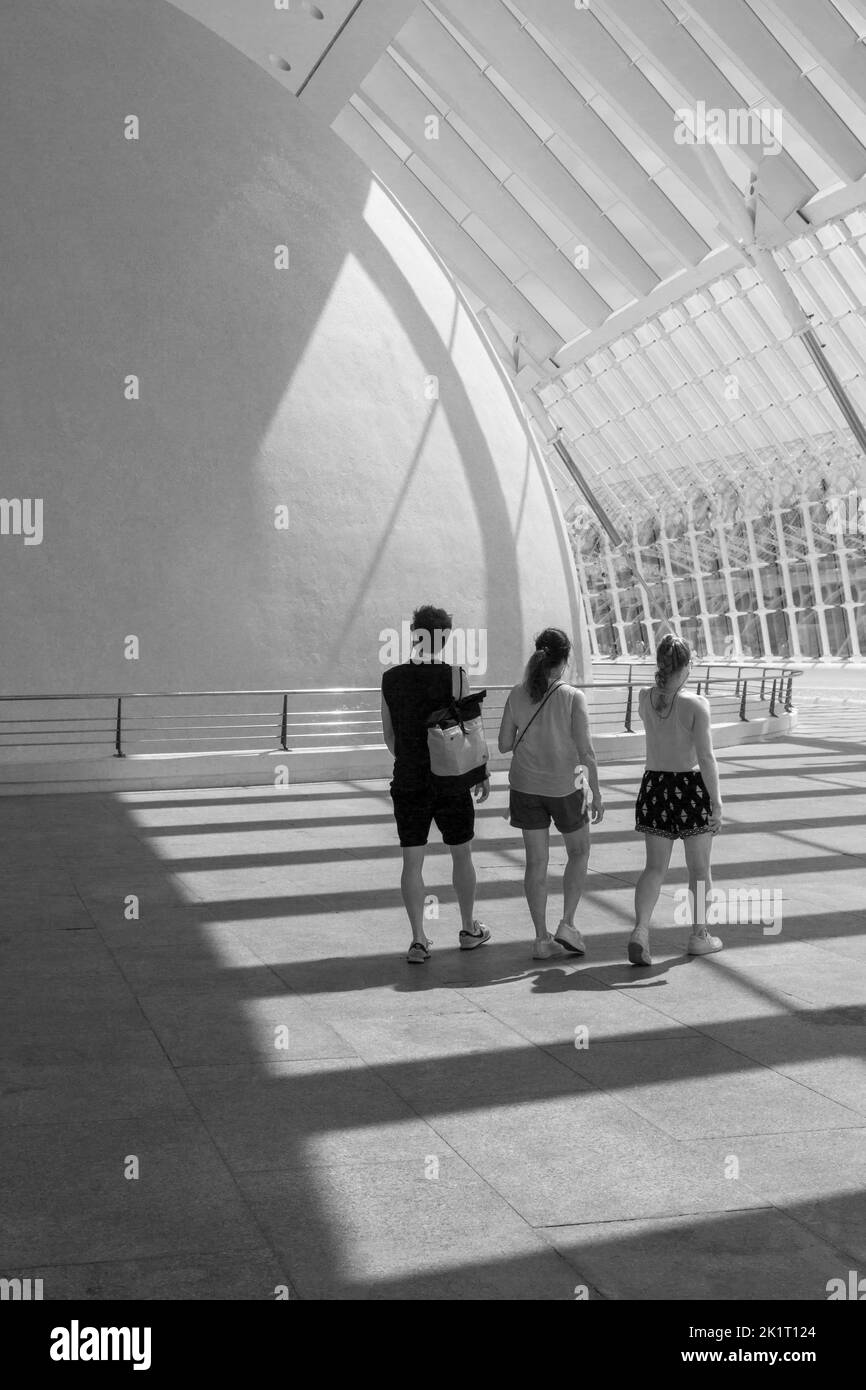 Visitors walking in the shadows through Hemisfèric, a digital 3D cinema & planetarium, at City of Arts and Sciences in Valencia, Spain in September Stock Photo