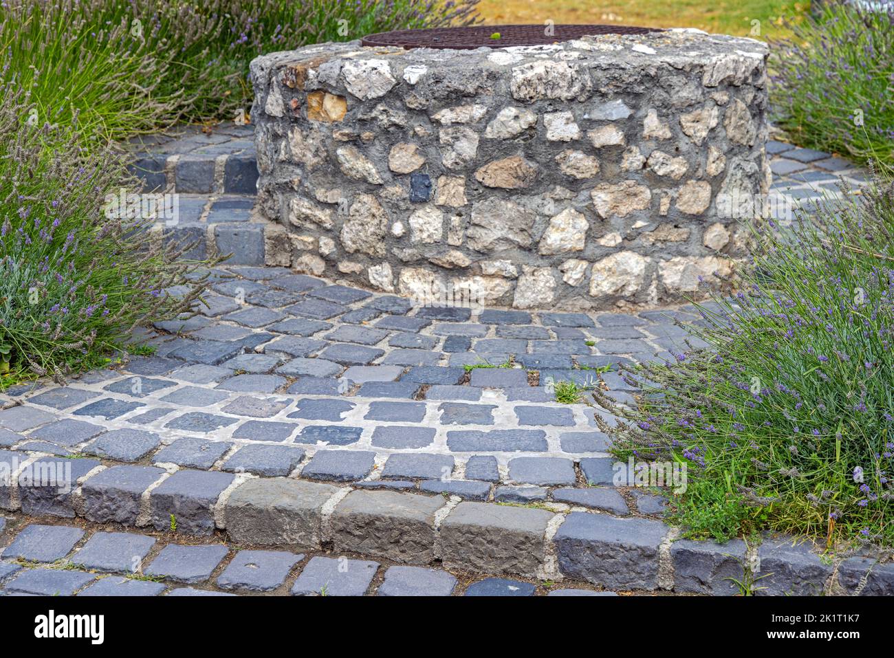 Budapest, Hungary - July 31, 2022: Old Water Well Round Stones Structure at Buda Castle. Stock Photo