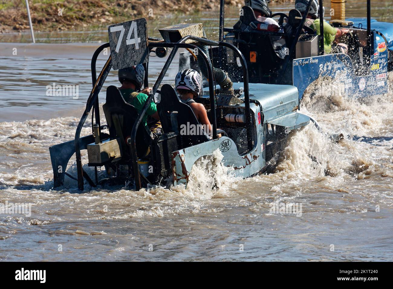 2 swamp buggies, moving through water, action, close-up, water spray, motion, jeep style, vehicle sport, Florida Sports Park, Naples, FL Stock Photo