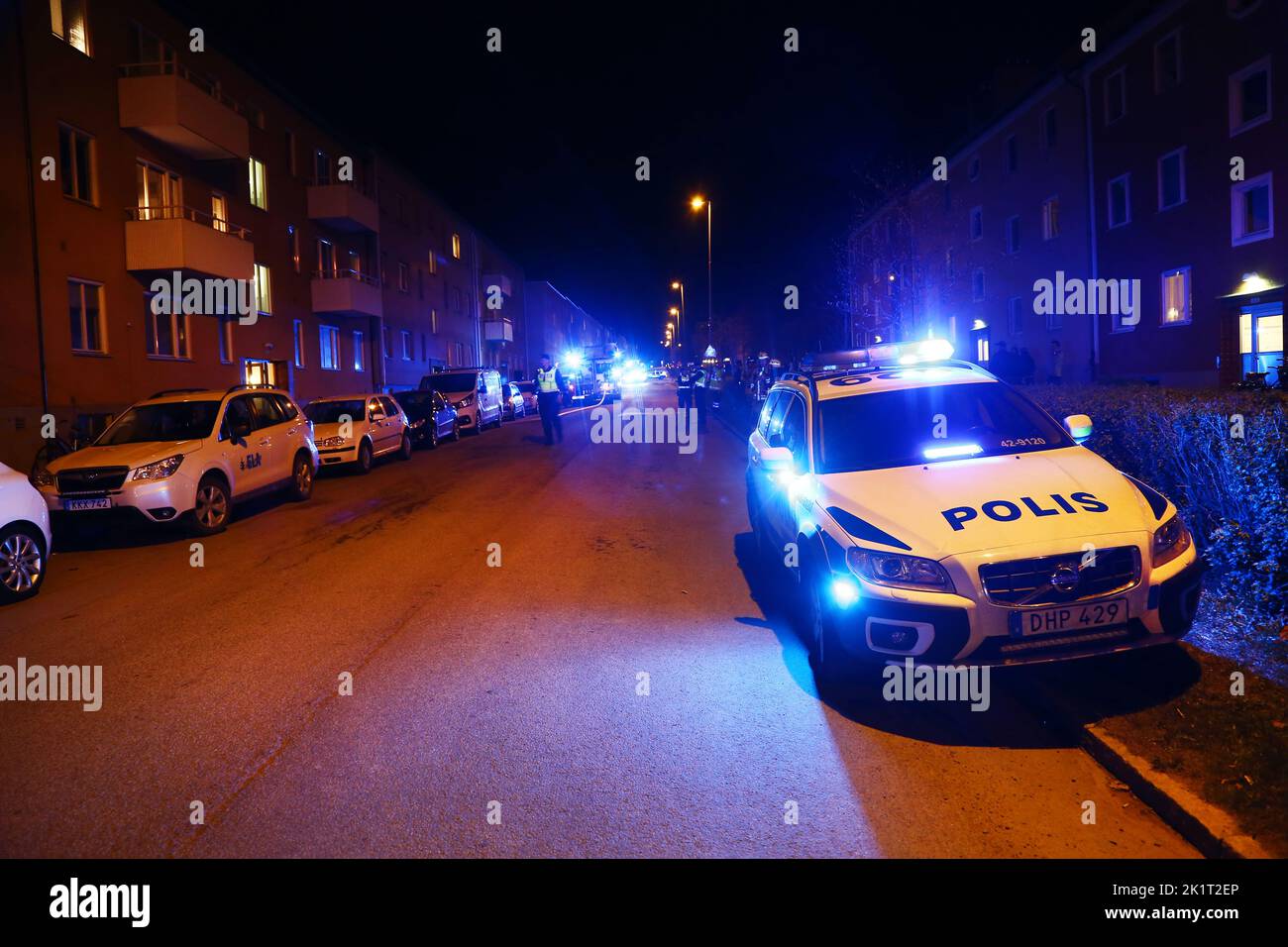A police car with blue lights on. Stock Photo