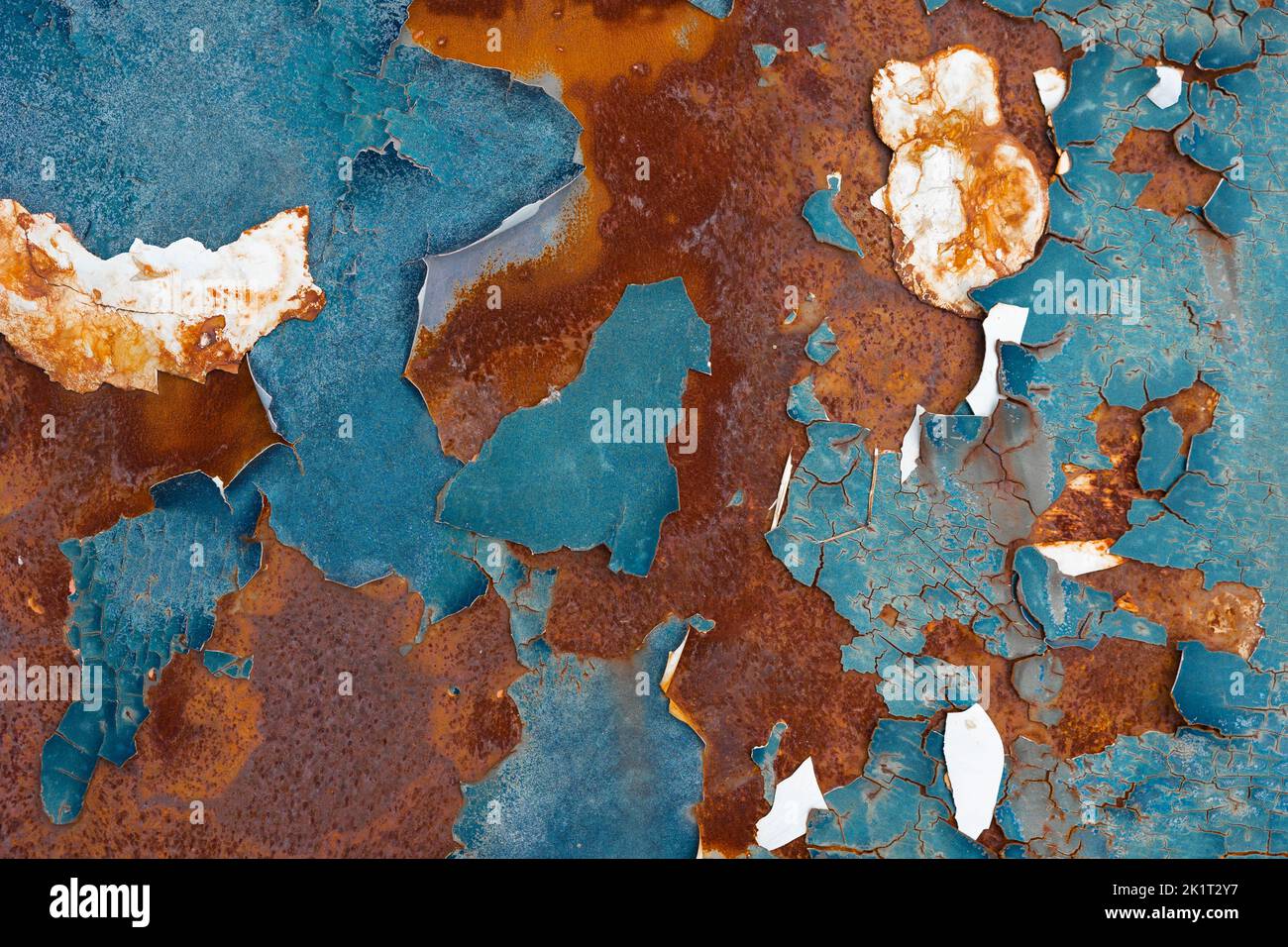 Car color crack old peeling paint on rusty metal steel auto part surface Stock Photo