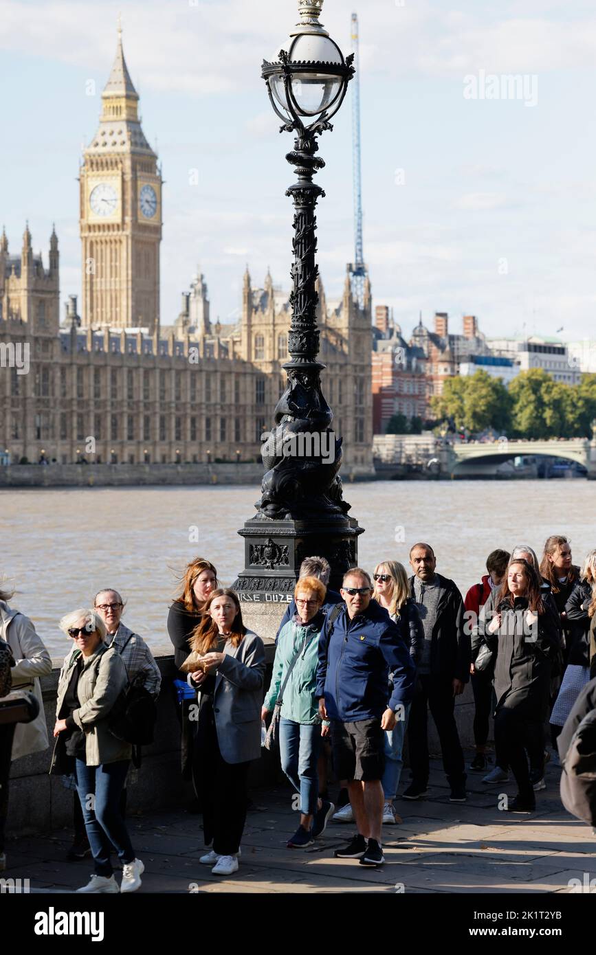 England, London, Mourners queueing along the banks of the river Thames to see the coffin of Queen Elizabeth II laying state in Westminster Hall. Stock Photo