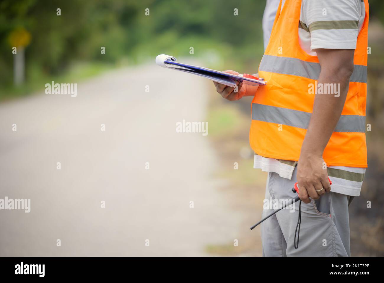 engineer male road site surveyor survey local countryside road for building construction work Stock Photo