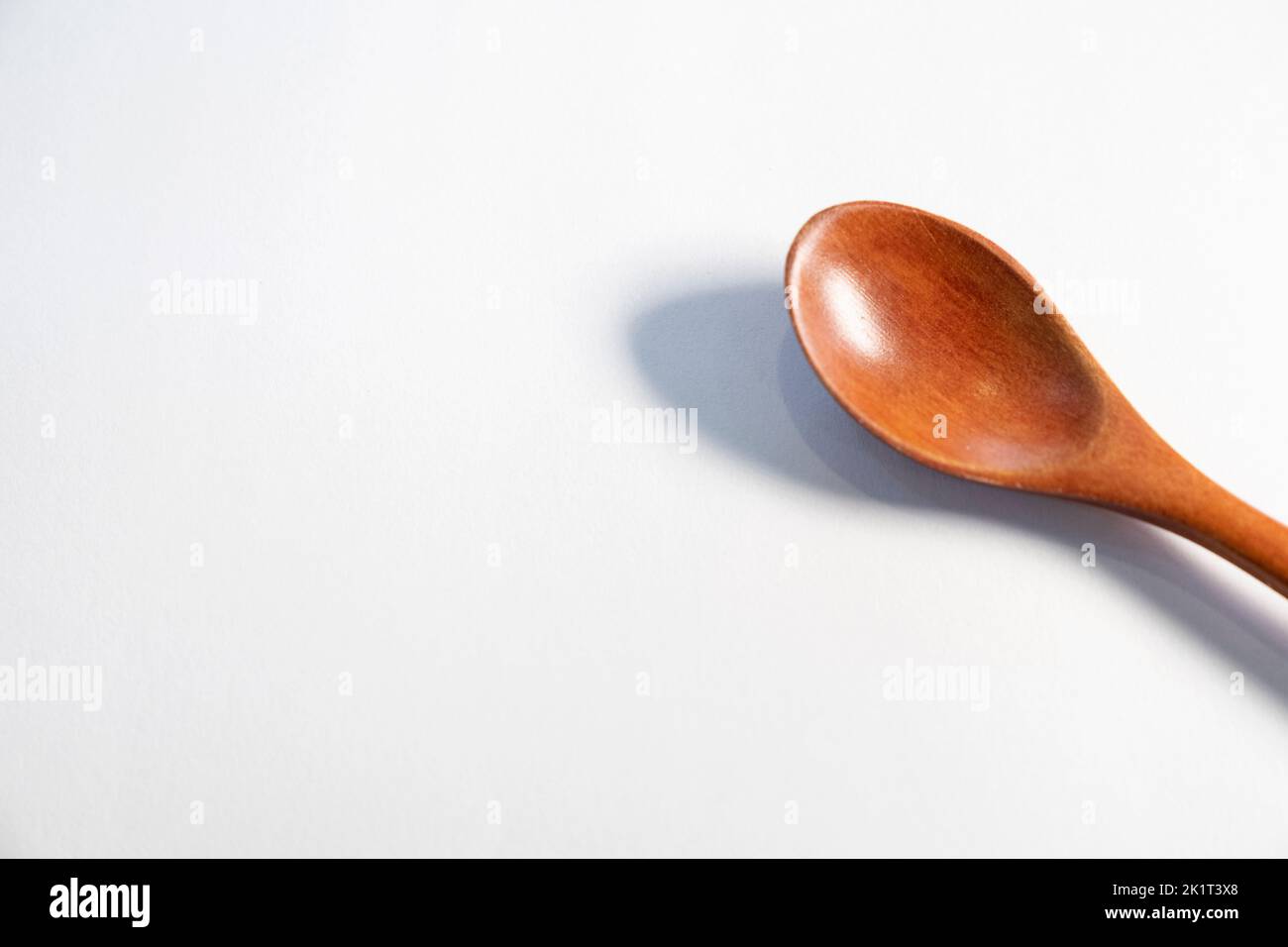 wooden spoon on isolated white background Stock Photo - Alamy