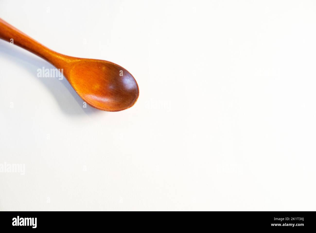 wooden spoon on isolated white background Stock Photo - Alamy
