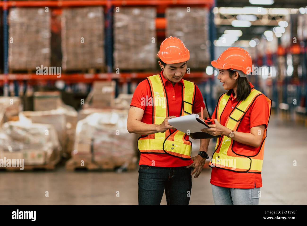 warehouse worker working together happy smile work checking inventory stock order for shipping. Stock Photo