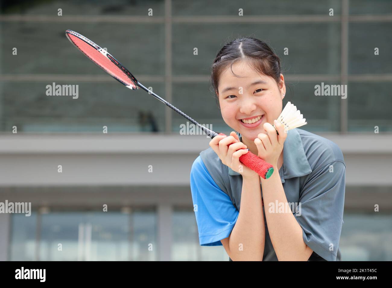 Healthy cute Badminton Asian Teen girl athlete sport player portrait happy smile Stock Photo