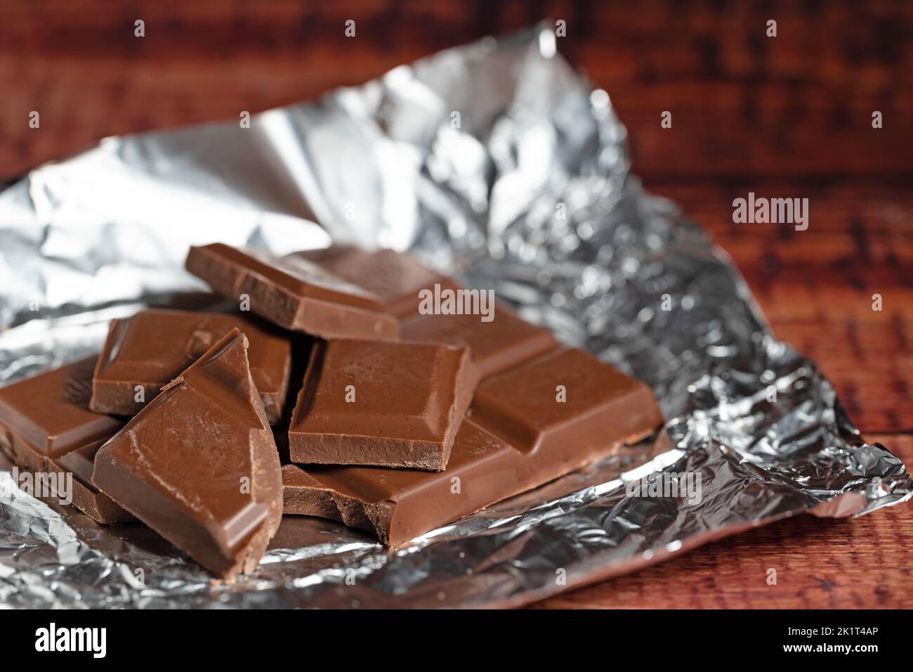 Chocolate pieces on silver paper Stock Photo
