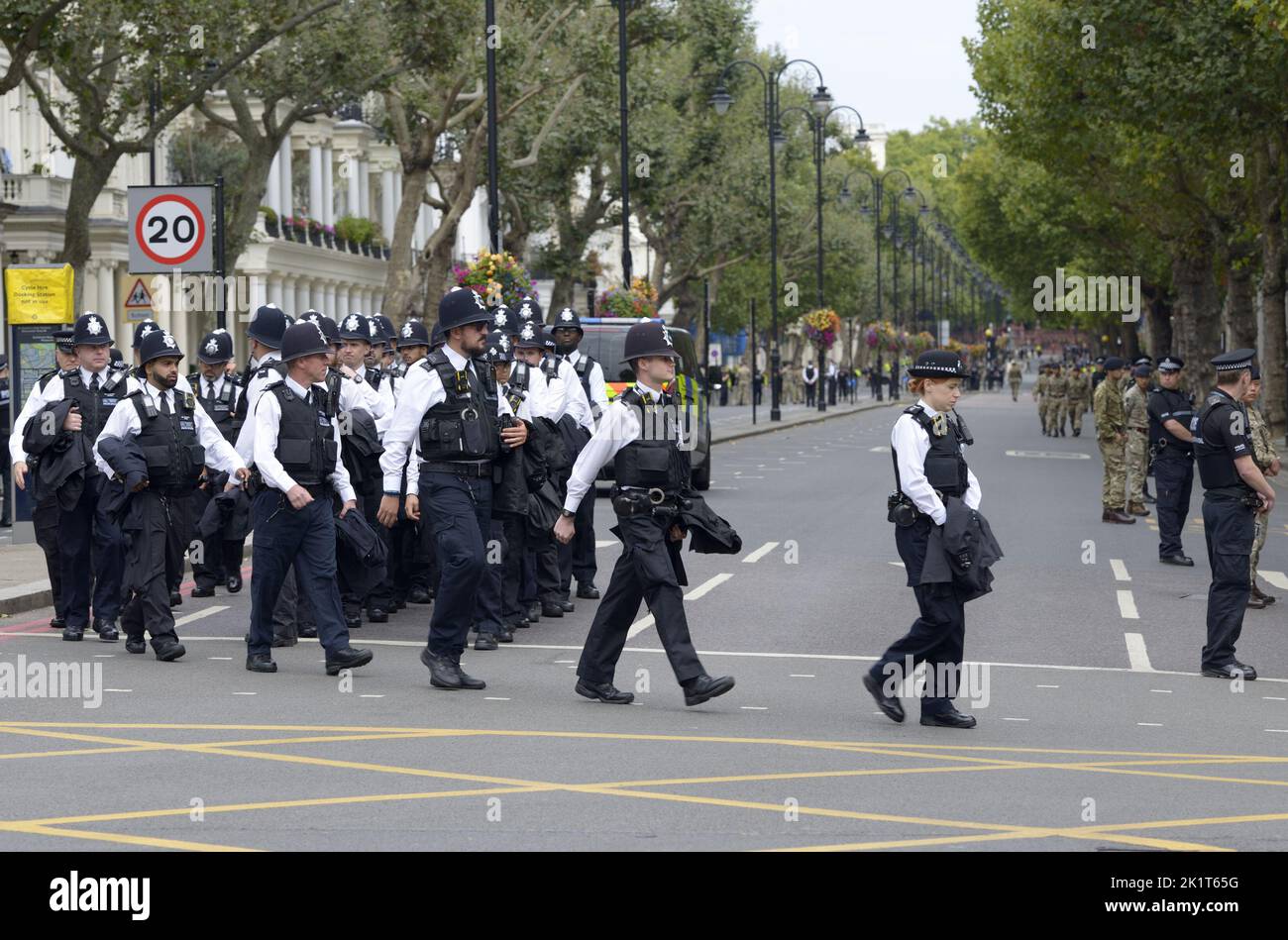 London, UK. The day of the State Funeral of Queen Elizabeth II. Police officers getting organised at the crossing of Queen's Gate and Cromwell Road. 1 Stock Photo