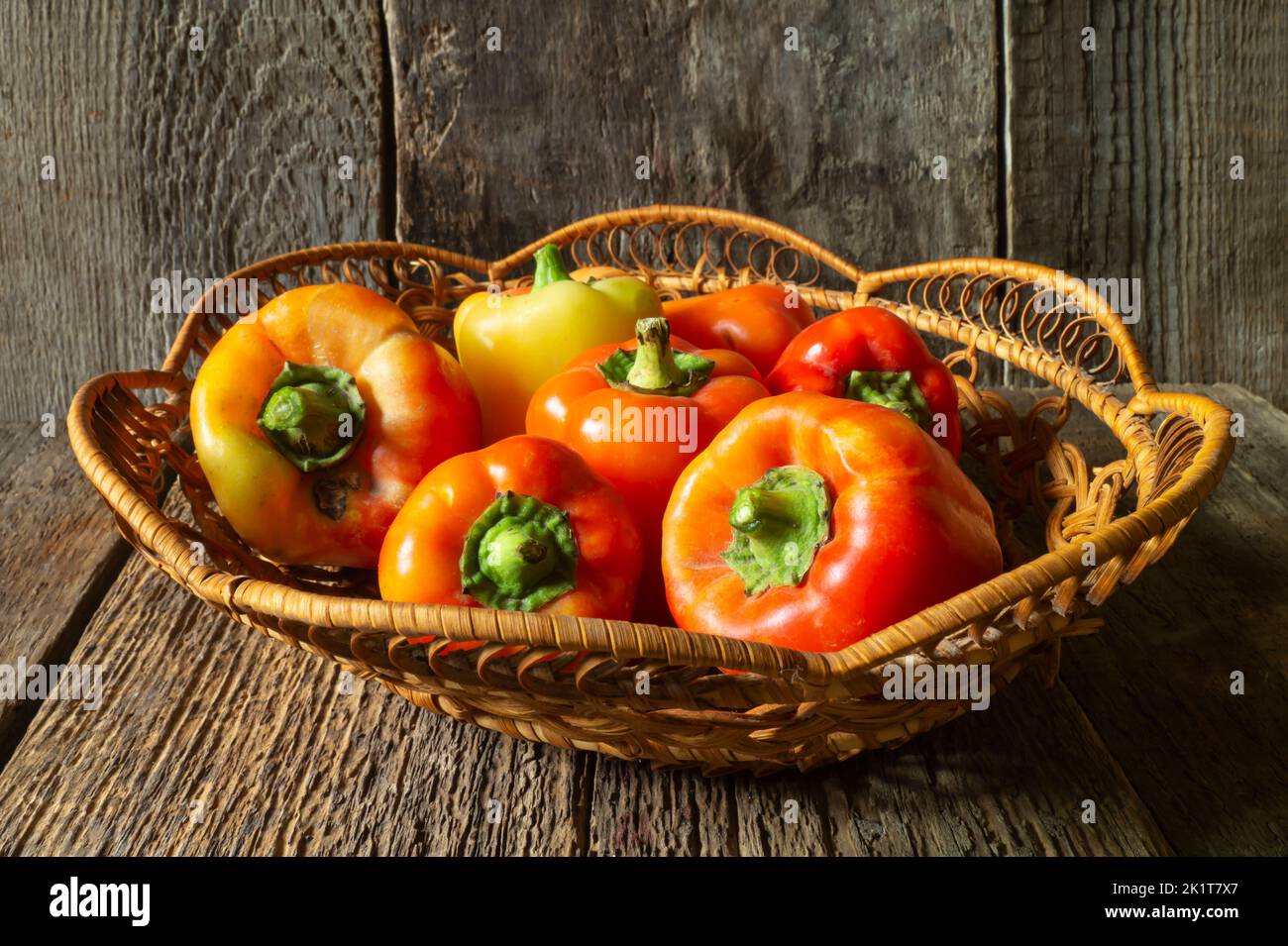 Bright vegetables on the background of old boards. Food is on the table in autumn. Juicy and ripe vegetables Stock Photo