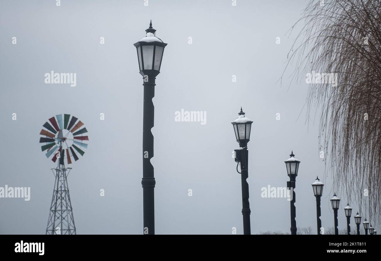 A row of street lamp posts on a foggy winter day in Wuhan, China Stock Photo