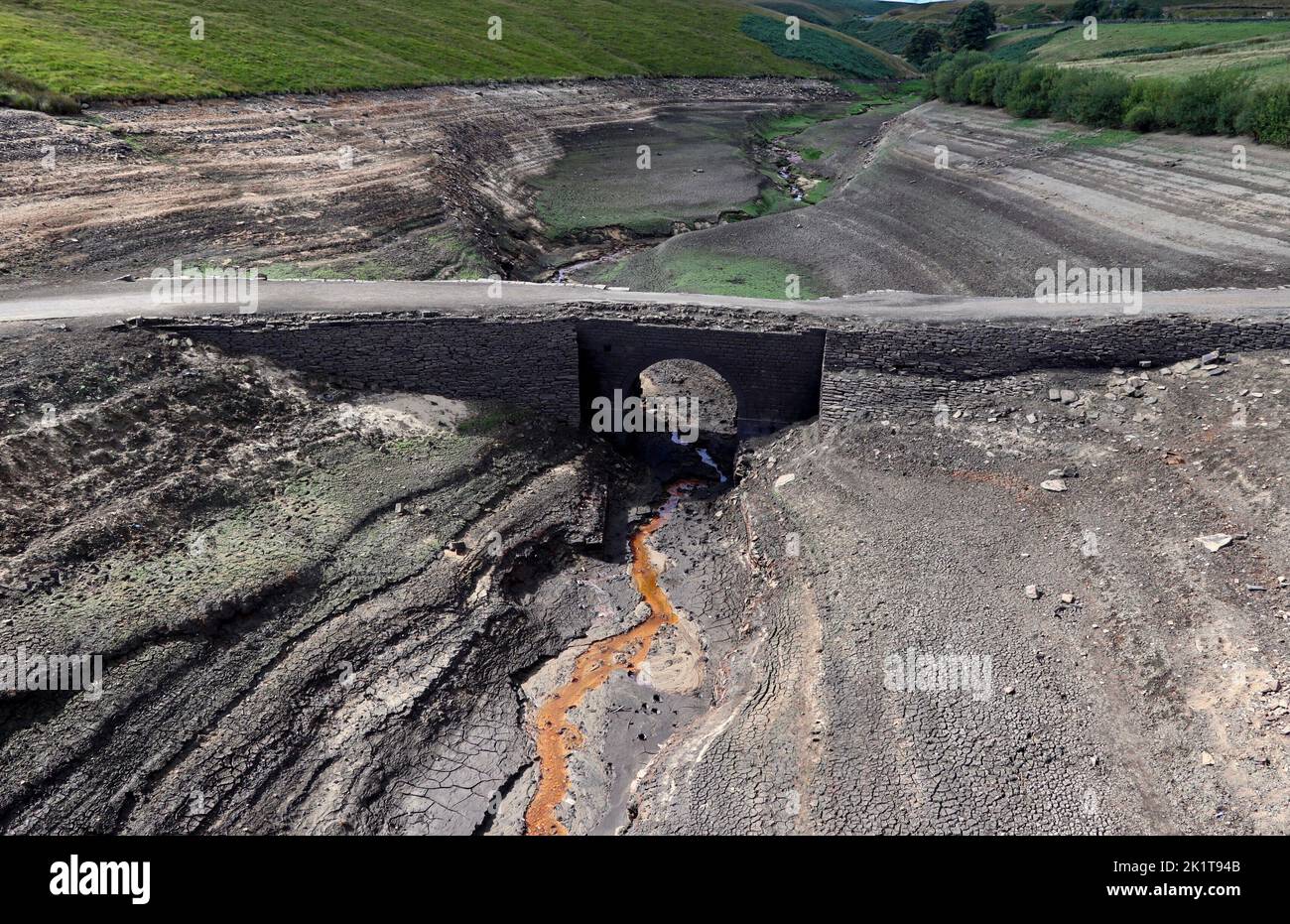 The old bridge at Baitings Reservoir, exposed during the drought of 2022. Stock Photo
