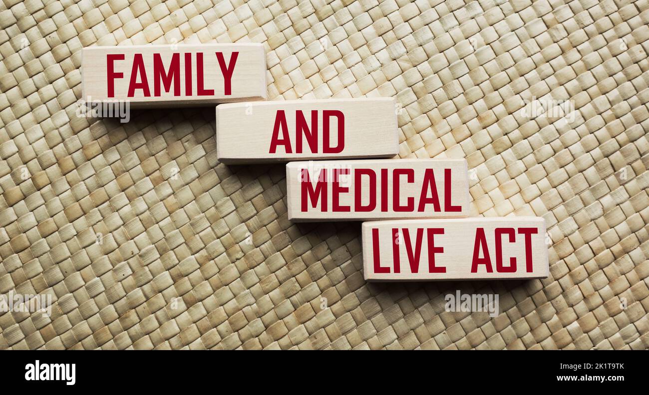 Wooden blocks with Family and Medical Live Act text on vintage table Stock Photo