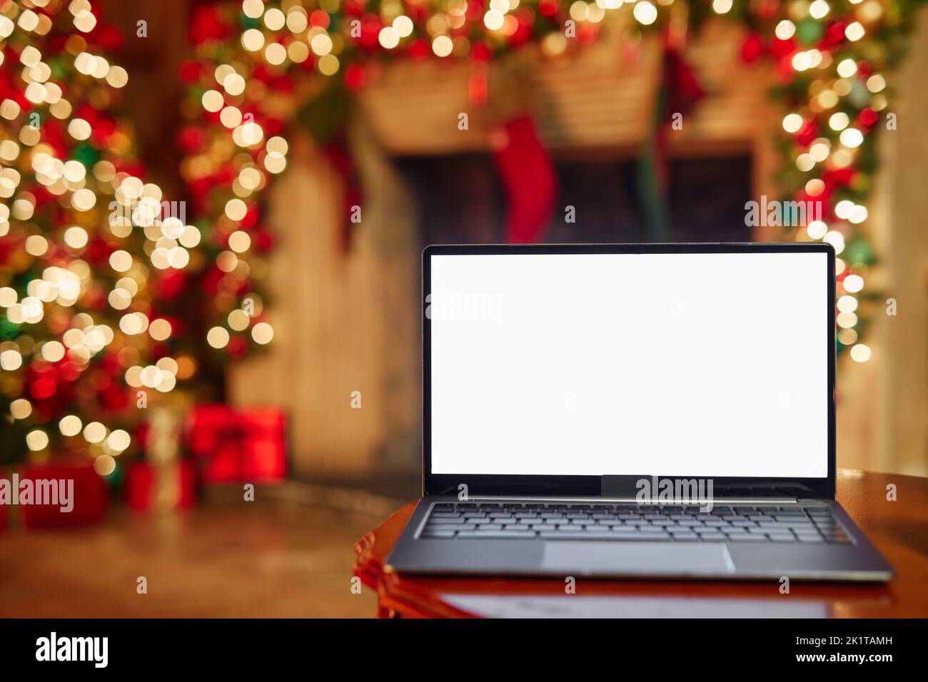 Close up of laptop screen mockup in festive room decorated for Christmas, copy space Stock Photo