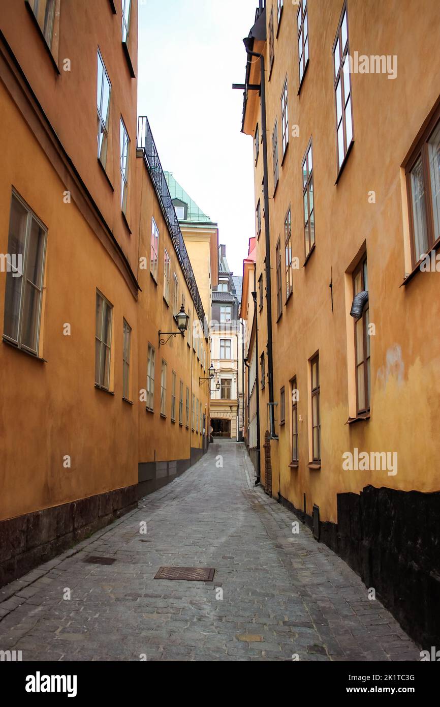 A vertical shot of a narrow street in a historic old town Stock Photo ...